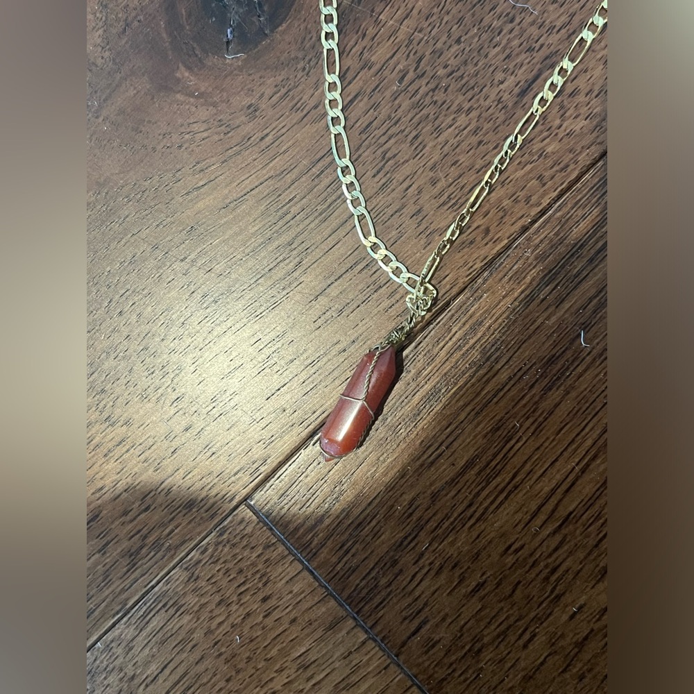 Garnet pendant on a gold chain
